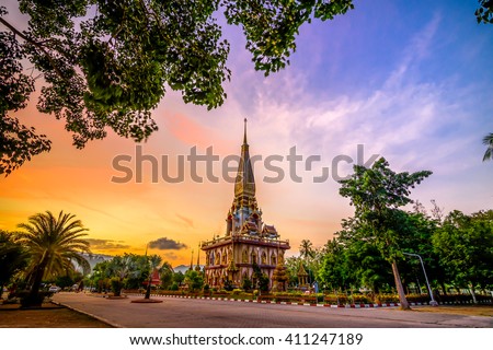 Pagoda in wat chalong or chalong temple with twilight background after sunset, public place.