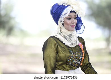 Pahang, Malaysia - May 7, 2014: Fashion portraiture of young beautiful muslim woman wearing hijab. Image contain certain grain or noise and soft focus. - Shutterstock ID 1172976436