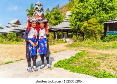 PAI, THAILAND - FEB 16, 2019 : Hmong children with nasal mucus,Portrait of H'mong(Miao) little girls wearing traditional dress during Lunar New Year holiday