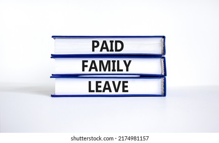 Paid Family Leave Symbol. Concept Words Paid Family Leave On Books. Beautiful White Table White Background. Business Medical And Paid Family Leave Concept. Copy Space.