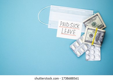 Paid Sick Leave With A Medical Mask And Money On A Blue Background. Dollars In A Pack And White Pills On Covid-19