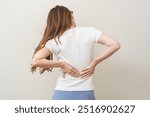 Pain body muscles stiff problem, asian young woman, girl painful with back, neck ache from work hand holding massaging rubbing shoulder hurt, sore on white background. Health care and medicine concept