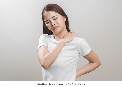 Pain body muscles stiff problem, asian young woman, girl painful with neck pain body ache from work, holding massaging rubbing shoulder hurt, sore on white background. Health care and medicine concept - Powered by Shutterstock