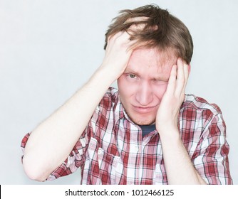 Pain Dental Concept. Man Portrait. Hands At The Head. On A White Ba