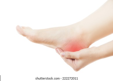 Pain in the foot. Massage of female feet. Pedicures. Isolated on white background.