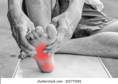 Pain in the foot. Massage of male feet. Pedicures.
