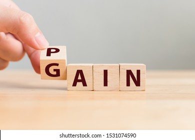 Pain or Gain concept, Hand flip wood cube change the word - Shutterstock ID 1531074590