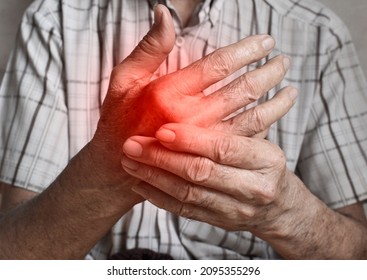 Pain in the hand of Southeast Asian elder man. Concept of hand pain, arthritis and joint problems.
