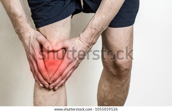 Pain in the knee of a man. Injury of the knee
in the athlete. Meniscus.