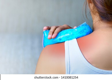 The pain in the neck and shoulder muscles is alleviated by cold compresses with cool gel.    - Shutterstock ID 1410081254