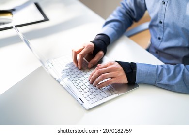 Pain Relief Bandage And Wrist Strap. Typing On Keyboard