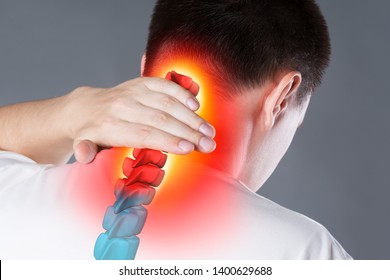 Pain In The Spine, A Man With Backache, Injury In The Human Neck, Chiropractic Treatments Concept With Highlighted Skeleton