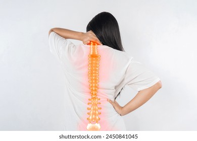 Pain in the spine, woman with backache on gray background, back injury, photo with highlighted skeleton - Powered by Shutterstock