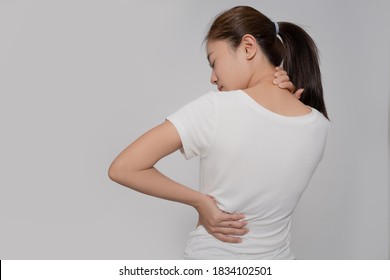 Pain In A Waman's Body, Asian Woman Has Neck Pain On A White Background.