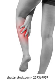 Pain In Woman Hamstring. Female Holding Hands On Spot Pain Hamstring.