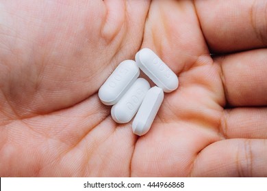 Painkiller On Man Hand