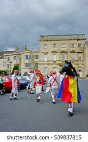 Painswick, The Cotswolds, Gloucestershire, UK. 9th August 2013. The Gloucestershire Morris men day of dancing, with Hobby Horse, in Victoria Square under a stormy sky