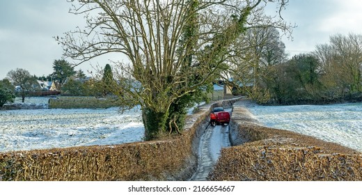 Painswick, Gloucestershire, UK, January 21st, 2022, Post Office Van And Car Stuck On Ice In A Narrow Lane Going Into The Village.