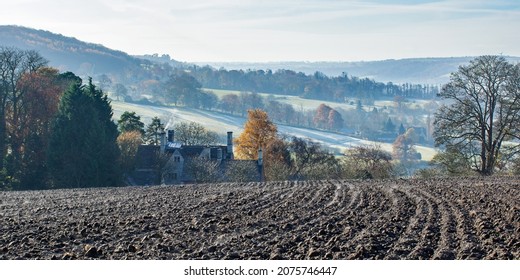 Painswick, Gloucestershire, UK, November 15th, 2021, A Misty Start To The Day Looking Over A Ploughed Field Towards An Isolated Cottage In Autumn.
