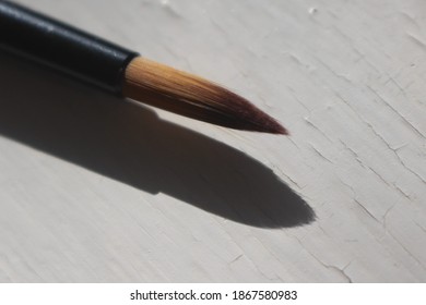 Paint brush close up with shadow