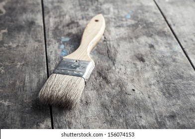 	Paint Brush On A Wood Surface, Close Up