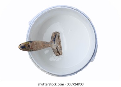 Paint brush in the paint tin isolated in white background