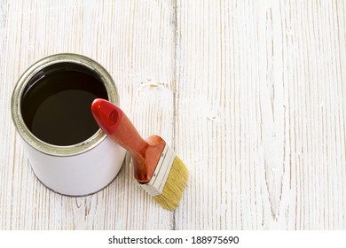 Paint Brush And Varnish Can, Paintbrush And Lacquer, White Color Container On Wooden Floor Background 