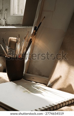Paint brushes and art painter notebook as artistic paint still life. art concept