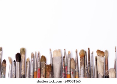 Paint brushes in the composition on the table