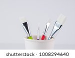 paint brushes in a cup