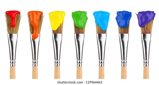 paint brushes with rainbow colors in front of white background