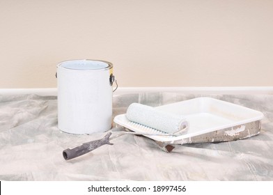 Paint Can And Roller Tray On Drop Cloth