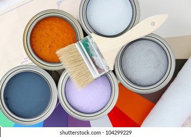 Paint cans ready to be used on white background