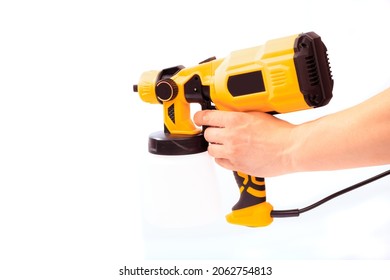 Paint Gun Holding By Mans Hand Isolated On White Background 