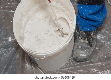 Paint Mixer And Bucket On Covered Floor 