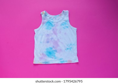 Paint On A White T-shirt. Isolated On Pink Background.