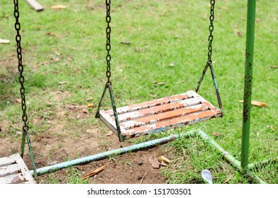 Paint Peeling On The Swings At The Playground.