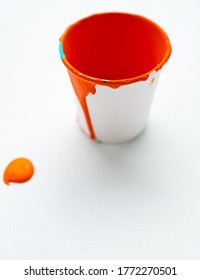 Paint Pot Filled With Orange Paint Isolated On White Background