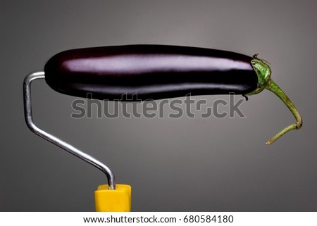 Paint Roller eggplant on gray background. Fashion food concept.Creative advertising