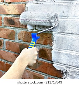 Paint roller through a brick wall