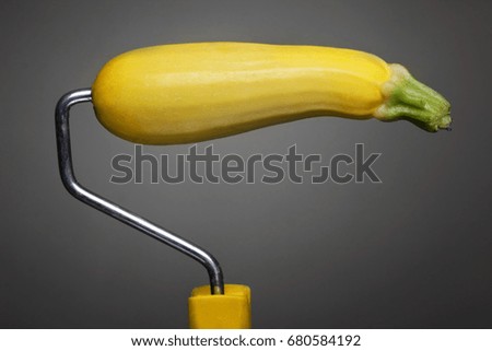 Paint Roller zucchini on gray background. Fashion food concept.