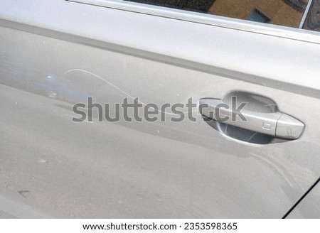 Paint scratches on a car door