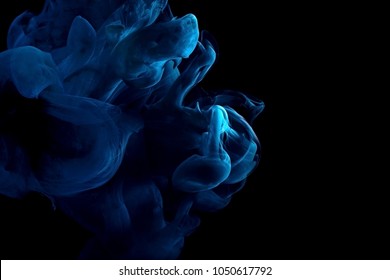 paint stream in water, red colored ink cloud, abstract background on a black,process of dissolution in water of a blue acrylic paint - Shutterstock ID 1050617792