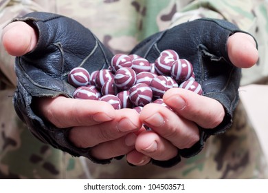 Paintball Balls In The Hands Of The Player