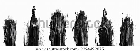 Paintbrush smear of black acrylic paint on a transparent background