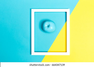 Painted Blue Apple On A Bright Split Color Background