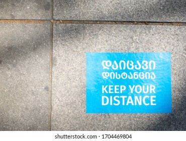 Painted blue sign with title 