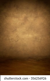 Painted canvas or muslin fabric cloth studio backdrop or background, suitable for use with portraits, products and concepts. Warm tones of brown and yellow, with floor area included for subject.
