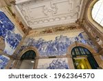 Painted ceramic tileworks on the walls of Main hall of Sao Bento Railway Station in Porto. The building of station is a popular tourist attraction of Europe