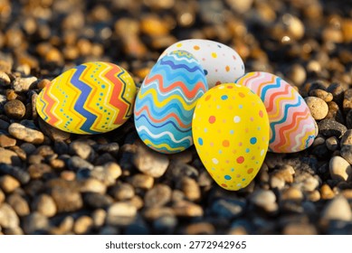 Painted colored Easter eggs, on spring background